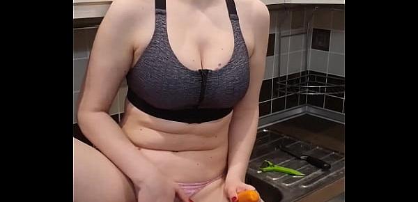  Horny Housewife Passionately Fingering Pussy With Carrots in the Kitchen